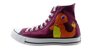 Charmander: Outside of the left shoe with a Charmander looking over his shoulder painted on it.